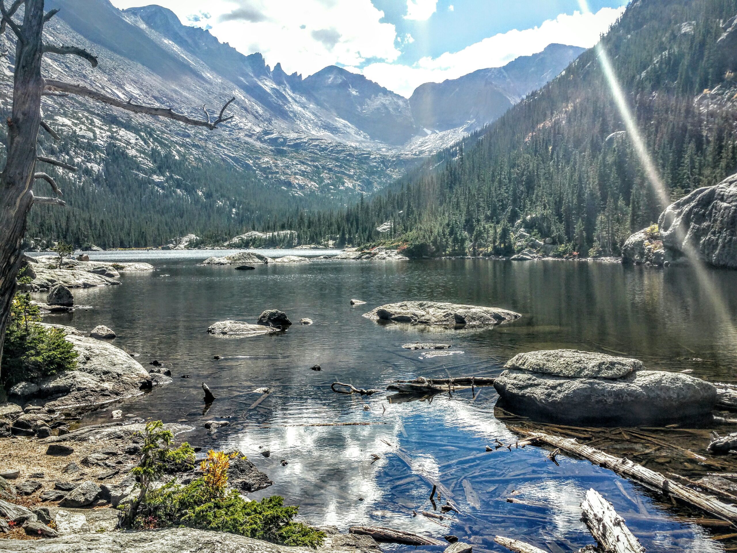 Mills Lake surrounded by fall colors and mountains in Rocky Mountain National Park, Colorado