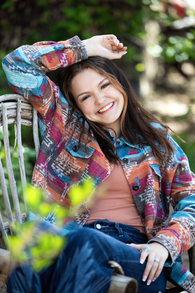 High school senior wearing a patterned shacket layered over a casual outfit in Eaton Colorado.