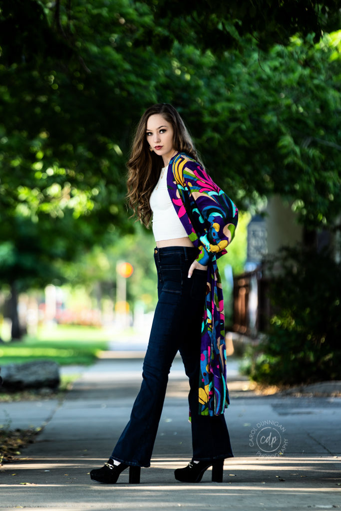 Maddie walking through Old Town Fort Collins during her senior pictures