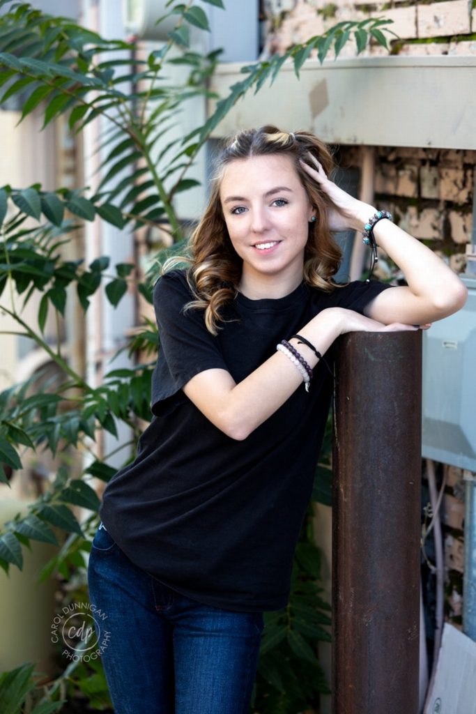 Demy posing in downtown Loveland during her senior portrait session